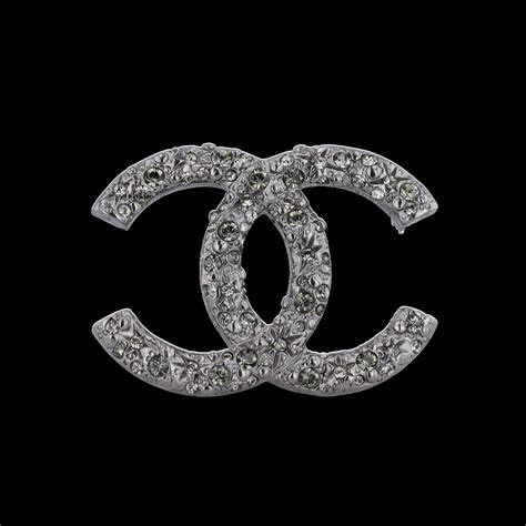 chanel broche suit|Chanel brooches.